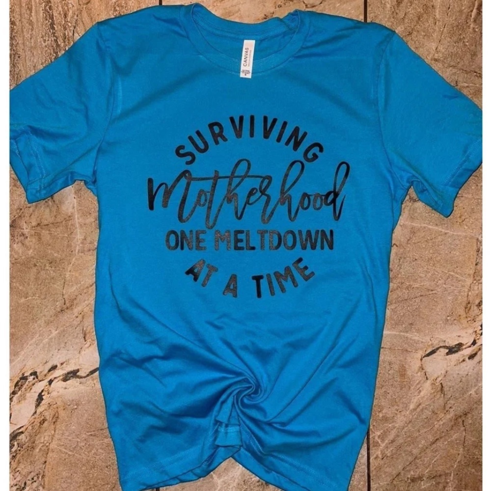 Women's Surviving Motherhood one meltdown at a time tee Size Medium